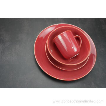 Reactive glazed stoneware dinner set in Claret-red